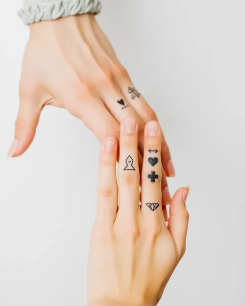 Couple Finger Tattoos: Permanent Mark of Devotion