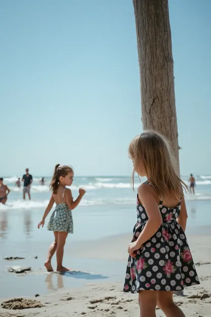 Little Girls Collecting Seashells at the Beach