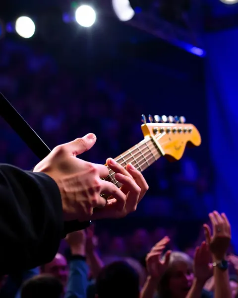 Musician Prepares for High-Fidelity Guitar Solo on Stage